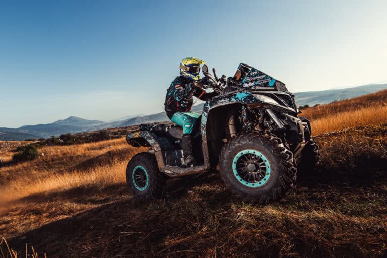 Quad rider on a dry grassy plateau