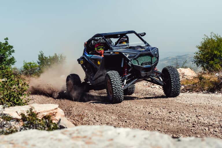 SSV sliding through dust on a rocky track