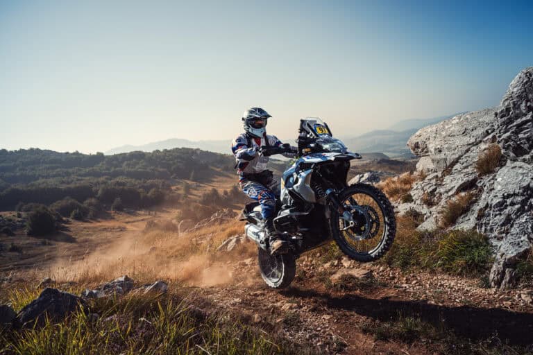 Rider on a mountain trail with a view of the sea