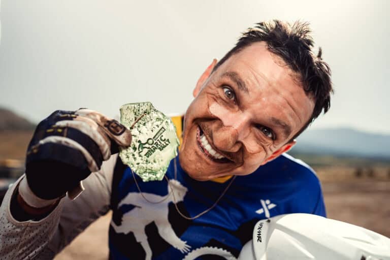 Smiling rider showing his stone finisher medal
