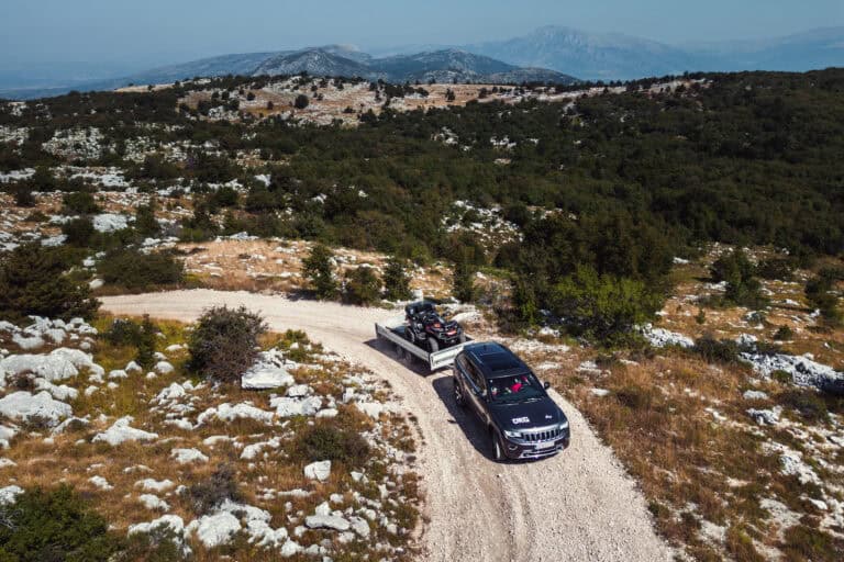 SSV on a gravel road across a karst plateau