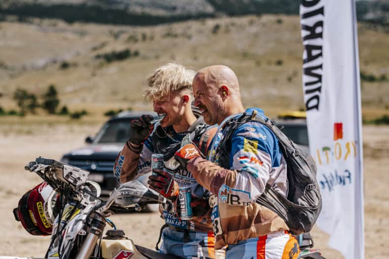 Rider and crew checking a bike before the start